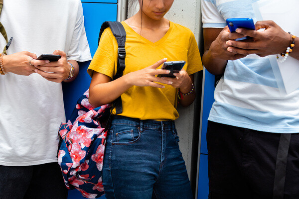 students holding cellphones