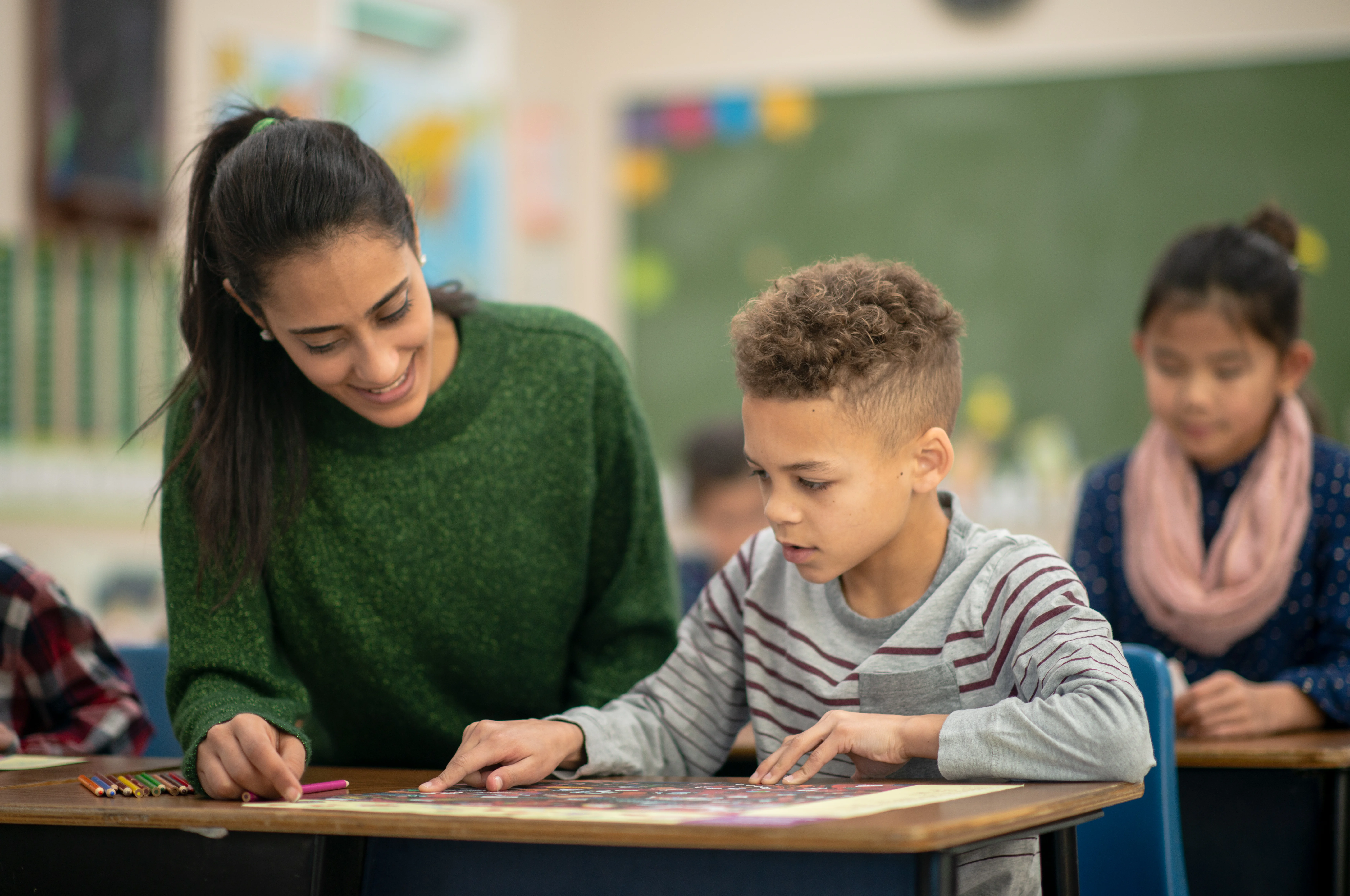 teacher helping frustrated student